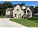 Charming brick home with an attached garage and a well-maintained front yard at 2571 Se Ebenezer Rd, Conyers, GA 30094