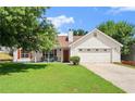 Inviting one-story home with a cozy front porch and lush green lawn at 7030 Kingston Ln, Mcdonough, GA 30253