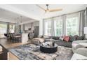 Open-concept living room featuring a large sofa, modern lighting, and seamless flow to the kitchen at 1762 Beckham Ne Pl, Atlanta, GA 30324
