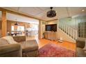 Cozy living room with wood trim, hardwood floors, and open floor plan at 1066 Sea Oats Sw Way, Lilburn, GA 30047