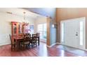 Elegant dining room with hardwood floors, natural light and a stylish chandelier at 1810 Stardust Trl, Cumming, GA 30040
