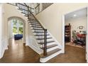 Welcoming foyer with wood floors, stairs, and an adjacent office space at 2055 Beacon Hill Way, Alpharetta, GA 30005