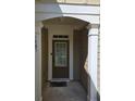 Welcoming front entrance with decorative columns and a secure front door at 1865 Ellison Lakes Nw Ct # 21, Kennesaw, GA 30152