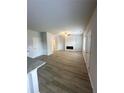 Spacious living room with a fireplace and wood-look flooring at 119 Deer Xing, Temple, GA 30179