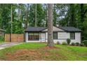 Beautiful home boasts a freshly painted exterior, modern windows, and a well-maintained lawn at 1719 San Gabriel Ave, Decatur, GA 30032