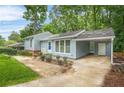 Inviting home exterior showcasing a covered parking and tasteful landscaping at 4981 Crowe Se Dr, Smyrna, GA 30082