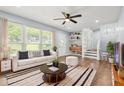 Bright living room with hardwood floors, large windows, and stylish decor at 4981 Crowe Se Dr, Smyrna, GA 30082