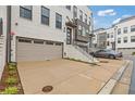 Close-up of a townhome with garage, painted brick, and landscaped entrance at 830 Stone Ridge Ln, Atlanta, GA 30324