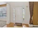 Inviting entryway with white trim, sidelights, and a classic white front door at 112 Rotherhithe Nw Ln, Marietta, GA 30066
