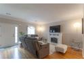 Cozy living room with fireplace, plush seating, and ample natural light at 3497 Mount Vernon Cir, Atlanta, GA 30340
