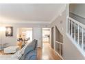 Open-concept living area with hardwood floors, natural light, and staircase at 3497 Mount Vernon Cir, Atlanta, GA 30340