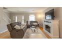 Comfortable living room featuring fireplace, soft rug, and stylish decor at 3497 Mount Vernon Cir, Atlanta, GA 30340