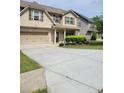 Charming two-story home with a well-manicured lawn and a two-car garage at 948 Regency Dr, Lawrenceville, GA 30044