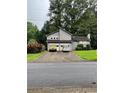 Charming gray two-story home with a two-car garage and well-maintained landscaping at 2977 Lowe Ne Trl, Marietta, GA 30066