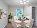 Cozy dining area with a glass table and modern chairs, great for Gathering dinners at 4230 Cheryl Ann Ct, Stone Mountain, GA 30083