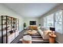 Bright living room with modern decor, stylish rug, and large windows at 4230 Cheryl Ann Ct, Stone Mountain, GA 30083