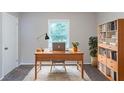 Bright home office with a large desk, ample storage, and a cozy rug at 4230 Cheryl Ann Ct, Stone Mountain, GA 30083