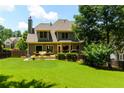 Spacious backyard with a deck, lush lawn, perfect for outdoor entertaining at 650 Chestatee Creek Nw Dr, Acworth, GA 30101