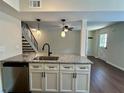 Modern kitchen with granite counters and stainless steel appliances at 1343 Old Coach Sw Rd, Marietta, GA 30008