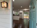 Inviting open-concept living space with hardwood floors flowing into the bright and modern kitchen at 2943 Westbury Dr, Decatur, GA 30033