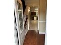 Inviting entryway with hardwood floors, staircase, and view into the kitchen at 2983 Trotters View Way, Snellville, GA 30039