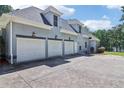 This residence offers a spacious three-car garage, providing ample parking and storage solutions at 1213 Grande Vw, Loganville, GA 30052
