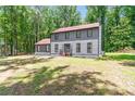 Well-maintained home with a charming exterior, nestled among mature trees at 155 N Fayette Dr, Fayetteville, GA 30214