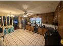 Functional kitchen featuring tile flooring and ample cabinet space at 4147 Scofield Pl, Stonecrest, GA 30083