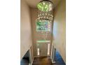 Open foyer with a modern chandelier and large windows providing natural light at 10950 Glenhurst, Duluth, GA 30097