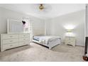 Bright bedroom featuring white furniture, neutral walls, and a serene ambiance at 1732 Winding Woods Ln, Jonesboro, GA 30236