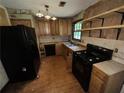 Galley kitchen with wood cabinets and appliances at 2612 Ramblewood Ct, Acworth, GA 30102