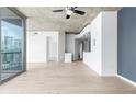 Open living area with hardwood floors, and balcony access showcasing city views and modern interior finishes at 3324 Peachtree Ne Rd # 2518, Atlanta, GA 30326