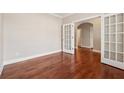 Sunlit office with hardwood floors and glass paneled french doors at 430 La Perla Dr, Sugar Hill, GA 30518