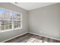 Sunlit bedroom with large windows and hardwood flooring, offering ample natural light at 5667 Cascade Sw Run, Atlanta, GA 30336