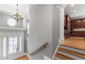 Grand foyer featuring hardwood floors, a chandelier, and views into the kitchen at 2291 Falmouth Se Ct # 23, Smyrna, GA 30080