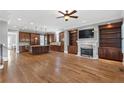 Spacious living room with fireplace, built-in bookshelves, and hardwood floors at 2291 Falmouth Se Ct # 23, Smyrna, GA 30080