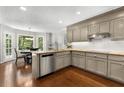 Well-lit kitchen with stainless steel appliances and view to back yard with a breakfast nook at 4875 Rivercliff Sw Trce, Lilburn, GA 30047