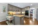 Kitchen with stainless steel appliances, granite counters, adjacent breakfast and dining areas at 4875 Rivercliff Sw Trce, Lilburn, GA 30047