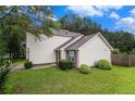 Well-maintained two-story home with a lush green lawn and mature landscaping at 6177 Idlewood Cir, Lithonia, GA 30038