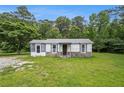 Charming home with stone accents and a well-maintained lawn at 1186 Eastview Ne Rd, Conyers, GA 30012