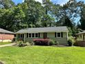 Beautiful one-story home with lush green lawn, tidy landscaping, and inviting curb appeal at 2985 Westbury Dr, Decatur, GA 30033