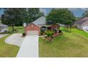Well-maintained home with a landscaped front yard and driveway at 3262 Beech Hollow Ct, Loganville, GA 30052