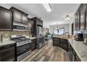 Spacious kitchen with stainless steel appliances and stone countertops at 3262 Beech Hollow Ct, Loganville, GA 30052