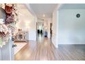 Inviting entryway with light wood floors, decorative accents, and an open view of the home at 4824 Sultana Sw Way, Atlanta, GA 30331
