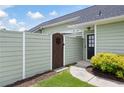 Private side yard with a wooden gate and low-maintenance landscaping, offering a cozy outdoor retreat at 418 Thaxton Ln, Woodstock, GA 30188