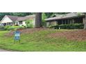 View of the house featuring a real estate sign for sale at 4525 N Landing Dr, Marietta, GA 30066