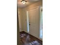 Inviting foyer with hardwood floors, a six-panel front door and sidelight window at 4525 N Landing Dr, Marietta, GA 30066