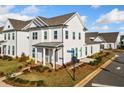 Attractive home with white siding, manicured landscaping, and a well-maintained lawn at 1026 Cagle Creek Ovlk, Canton, GA 30115