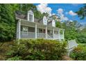 View of a charming two-story home with a inviting front porch at 55 Legend Creek Cv, Douglasville, GA 30134