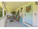 Charming front porch with comfortable seating and stylish decor, welcoming guests at 1035 Cornish Mountain Church Rd, Oxford, GA 30054